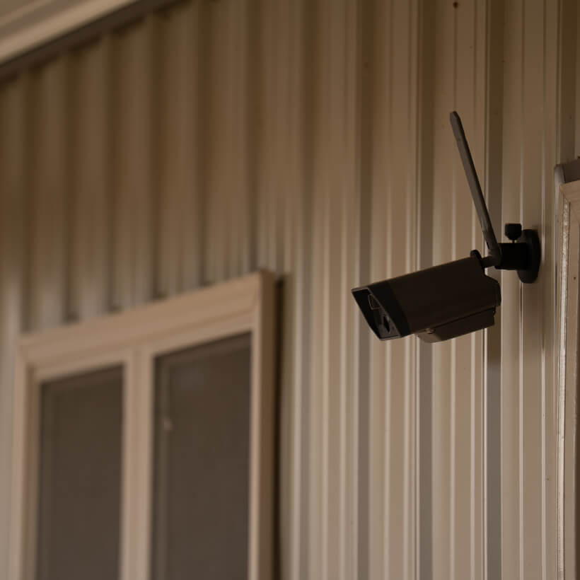 Tactacam DEFEND Cam mounted on a steel building with the Magnetic Mount
